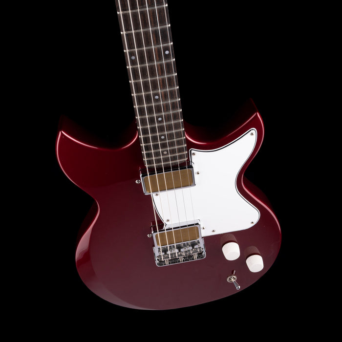 Red electric guitar with a white pickguard on a black background