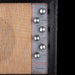 Close-up of a vintage amplifier with control knobs and 'Silverstone' branding.