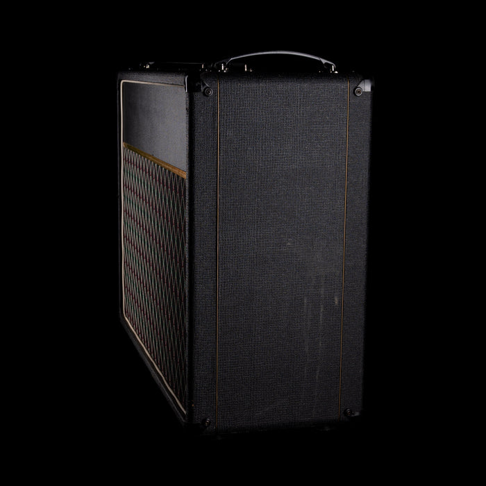 Vintage-style guitar amplifier with a textured black finish on a white background