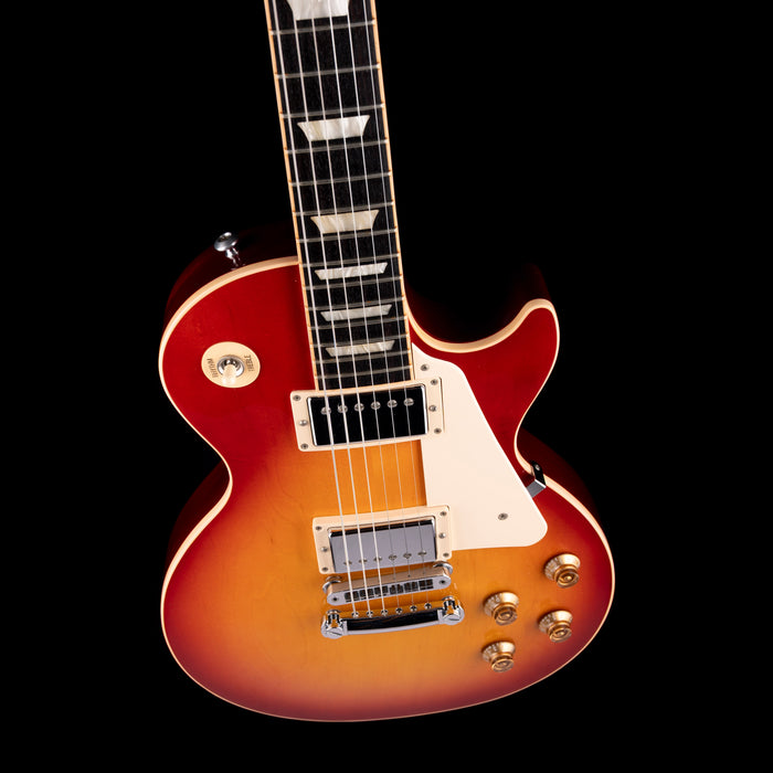 Electric guitar with a sunburst finish on a black background