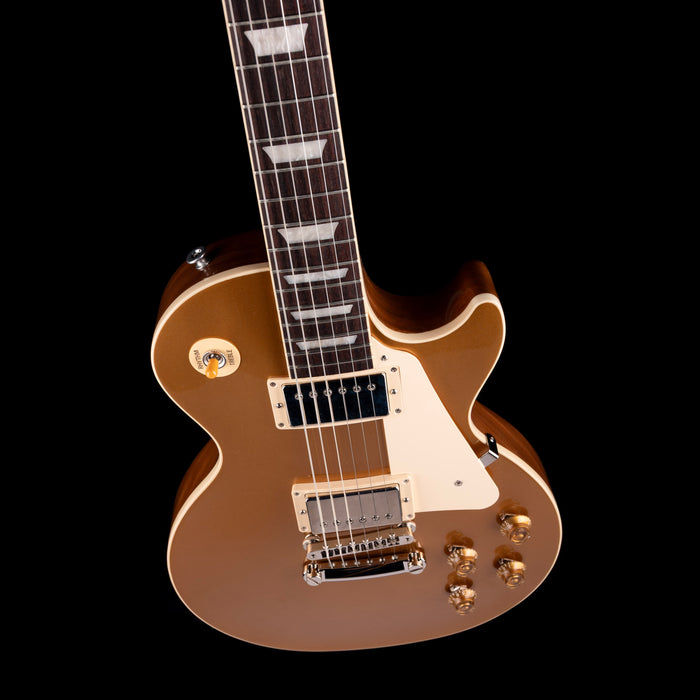Electric guitar with a brown finish on a black background