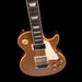 Electric guitar with a brown finish on a black background