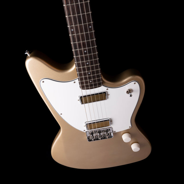 Electric guitar with a beige body and white pickguard on a black background
