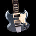 Electric guitar with a black and silver design on a black background