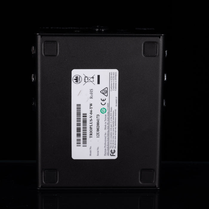 The back of a black metal power supply or electronic component, featuring a white label with barcodes, certification logos, and text including 'TROPLUS-V-44TW'.
