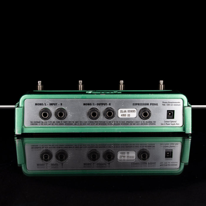 Guitar effects pedal with control knobs on a black background