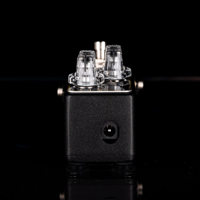 Small electronic device with clear components on a black background