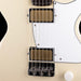 Close-up of a guitar's neck and headstock on a beige background