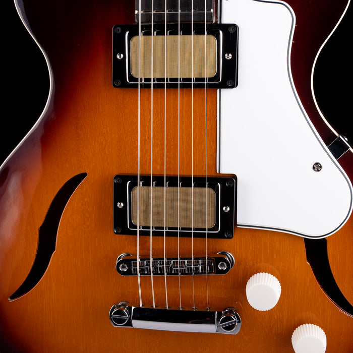 Close-up of a guitar with a focus on the neck and body