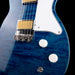 Close-up of a blue electric guitar with a black background