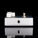 Guitar effects pedal with two knobs on a black background
