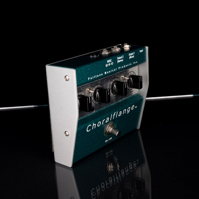 Guitar effects pedal with 'Choralflange' branding on a reflective surface.