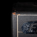 Close-up of a vintage amplifier with a brand logo on a black background