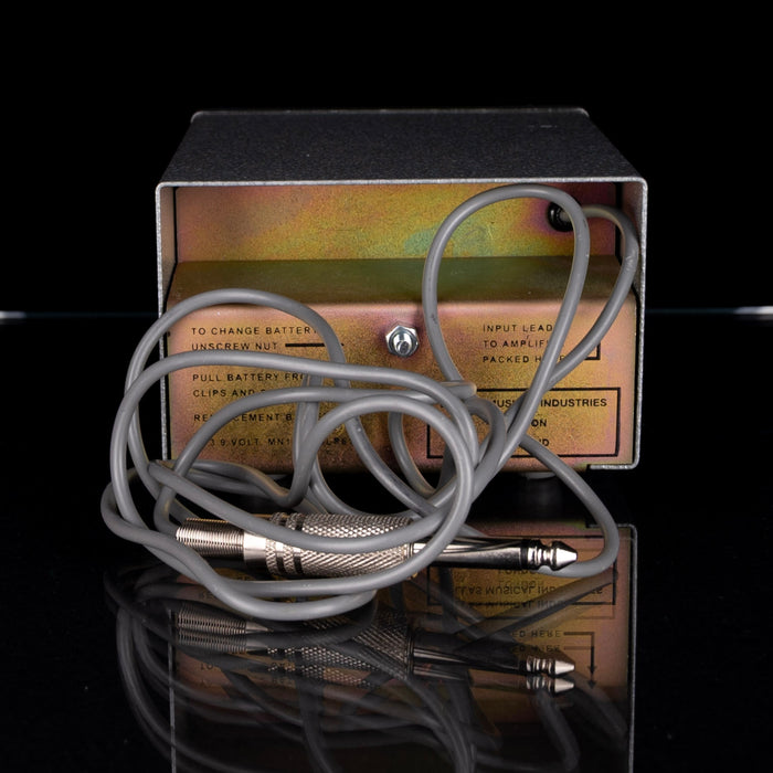 Electrical device with coiled cable on a reflective surface