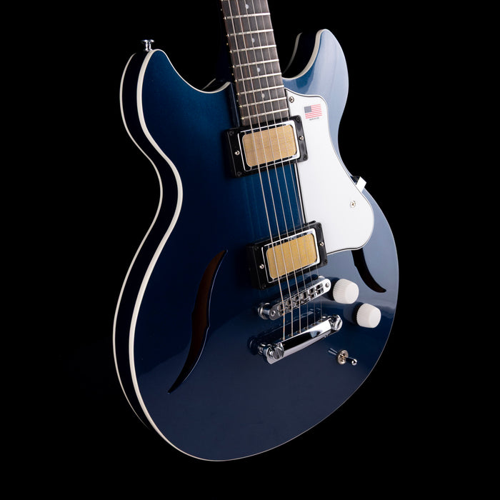 Blue electric guitar on a black background