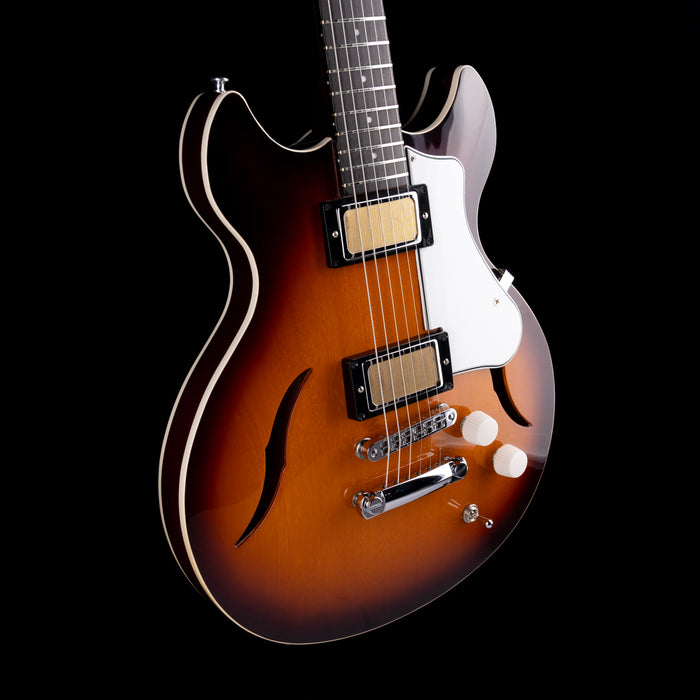 Electric guitar with a sunburst finish on a black background