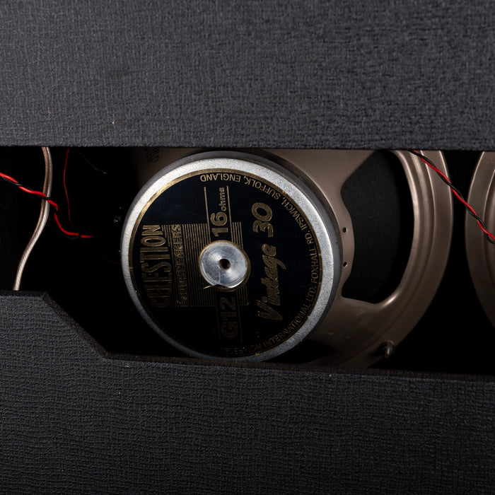 Close-up of a vinyl record with a turntable needle on a dark background