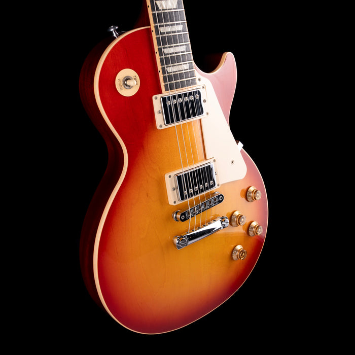 Electric guitar with a sunburst finish on a black background