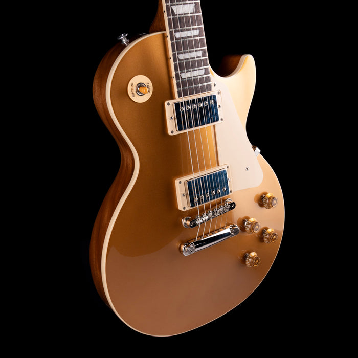 Electric guitar with a sunburst finish on a black background