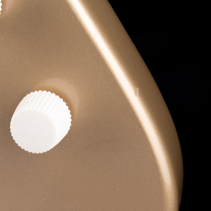 Close-up of a white shell on a brown surface with a black background