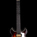 Electric guitar with a sunburst finish on a black background