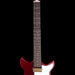 Red electric guitar with a black background