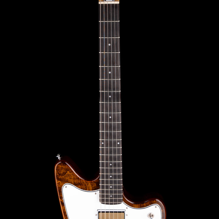 Electric guitar with a white pickguard and brown body on a black background