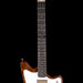 Electric guitar with a white pickguard and brown body on a black background