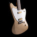 Beige electric guitar with a white pickguard on a black background