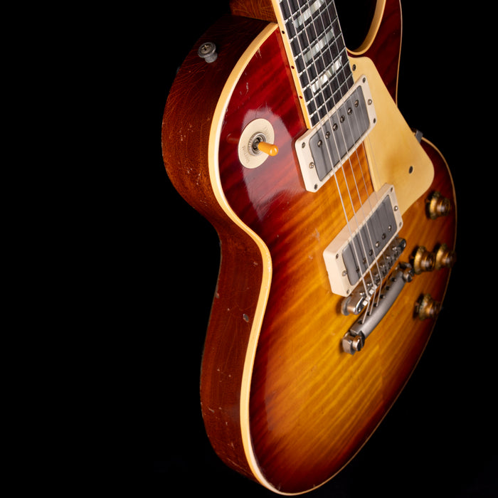 Gibson Les Paul electric guitar with a sunburst finish on a black background