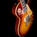 Gibson Les Paul electric guitar with a sunburst finish on a black background