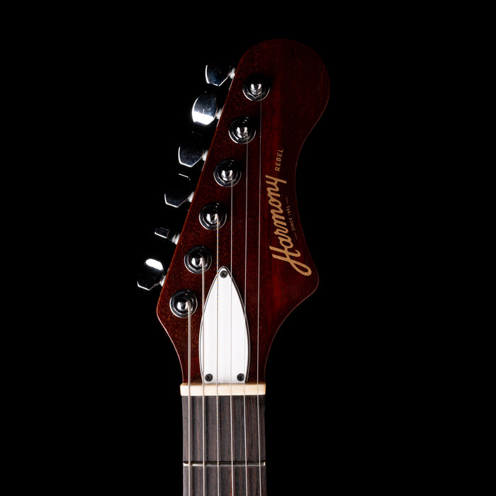 Guitar headstock with 'Harmony' branding on a black background