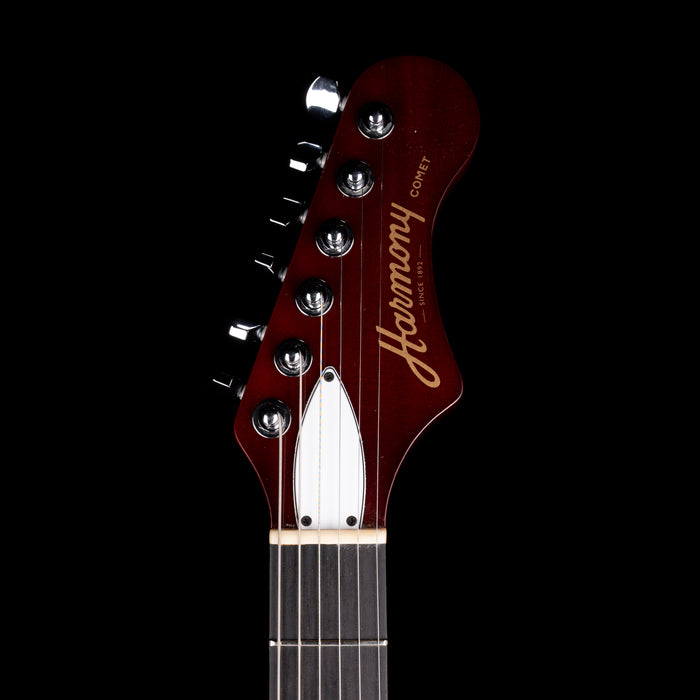 Guitar headstock with 'Harmony' branding on a black background