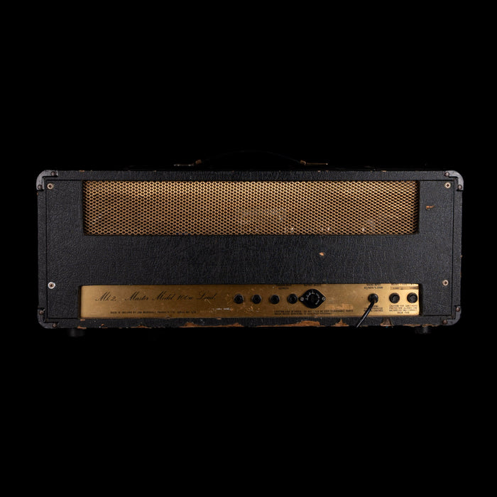 Vintage guitar amplifier head with a black cabinet and gold grille on a white background