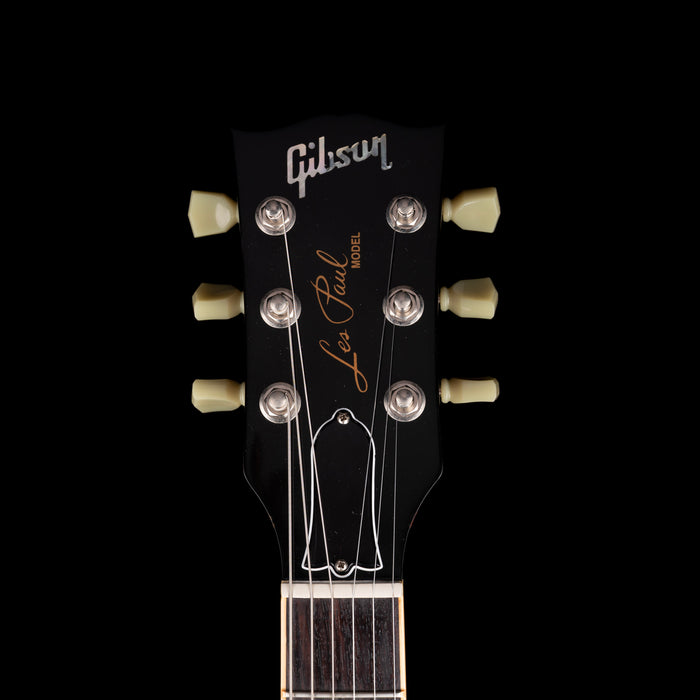 Gibson Les Paul guitar headstock on a black background
