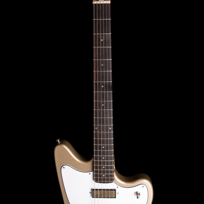 Electric guitar with a gold and white design on a black background