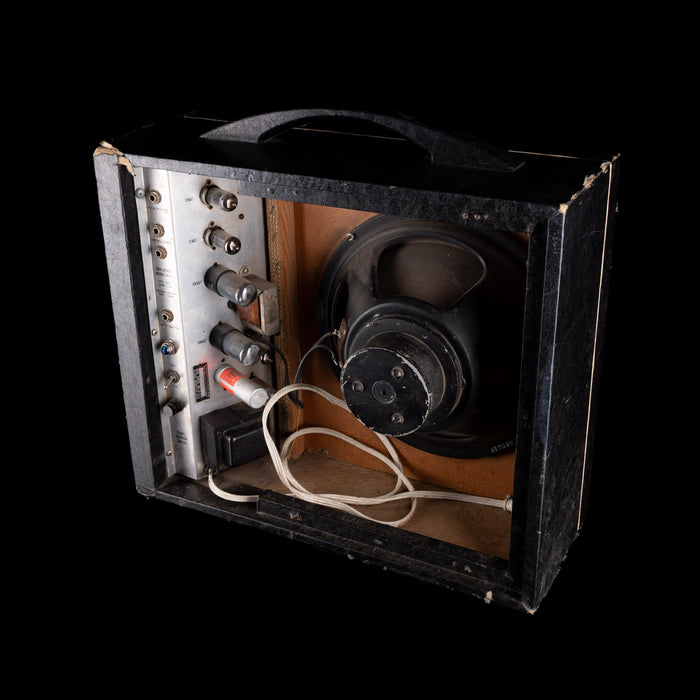 Vintage-style amplifier with speaker and control panel on a black background