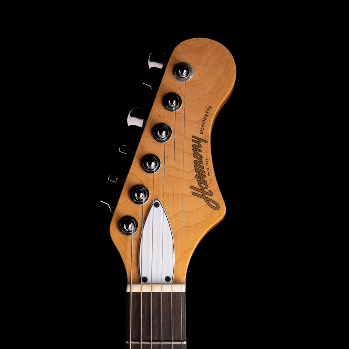 Guitar headstock with 'Herman' branding on a black background