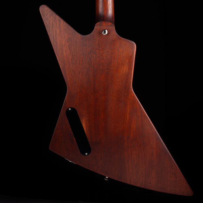 Wooden guitar body on a black background