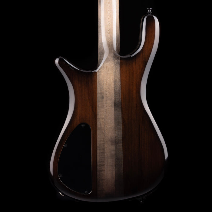 Wooden guitar body with a dark finish on a black background