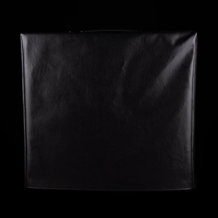 Black leather-bound book on a black background