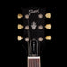 Gibson guitar headstock with 'Tweed' branding on a black background